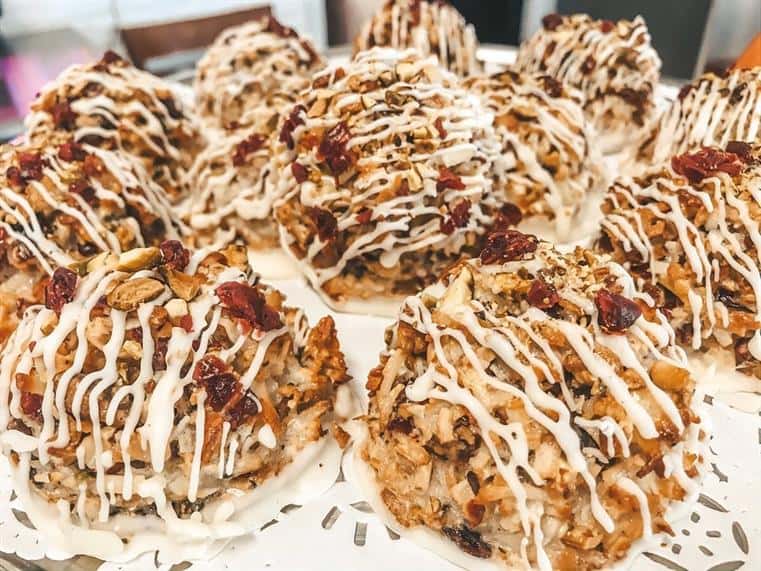 granola balls with yogurt drizzle and dried cranberries