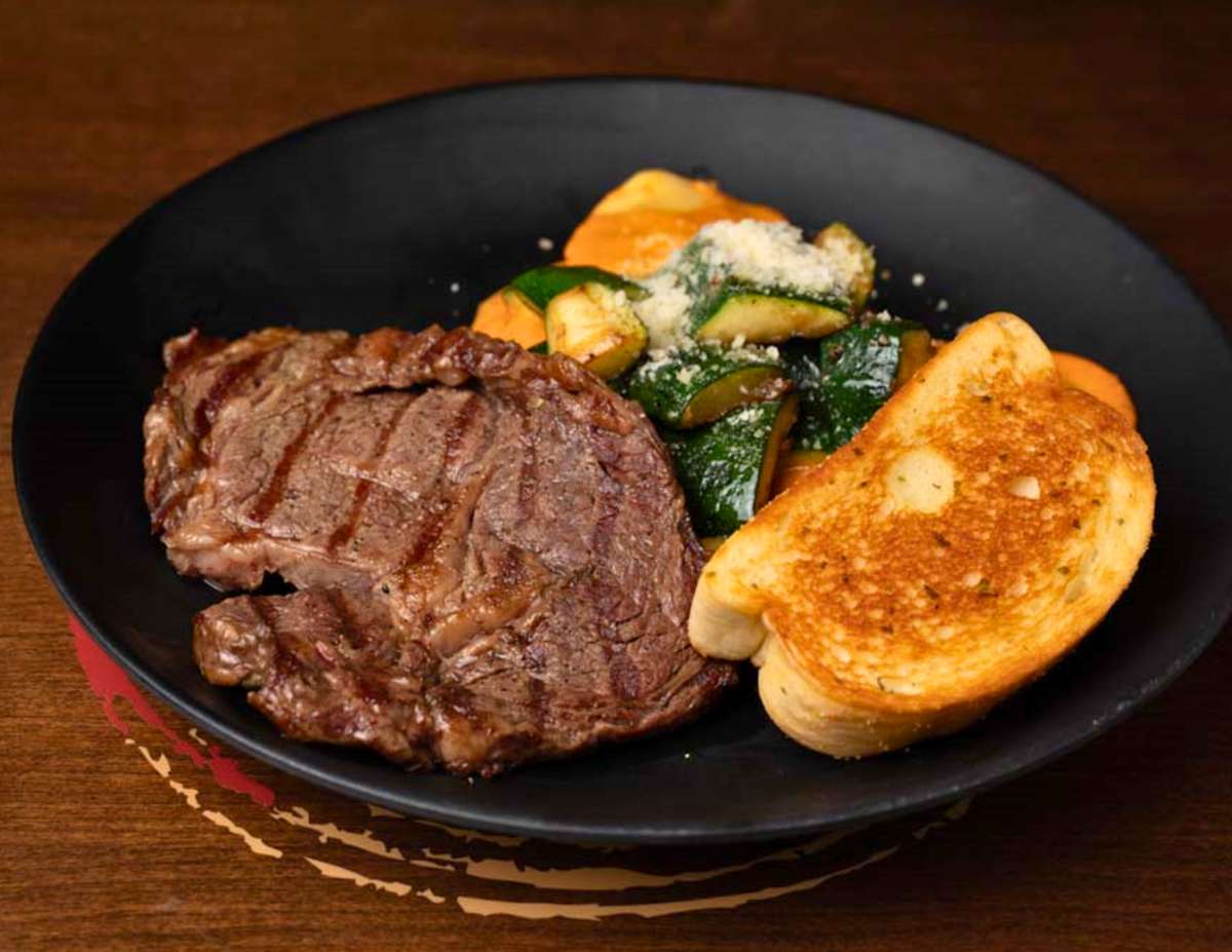 6 oz. ribeye steak, six-cheese ravioli, tomato cream sauce, seasonal vegetables