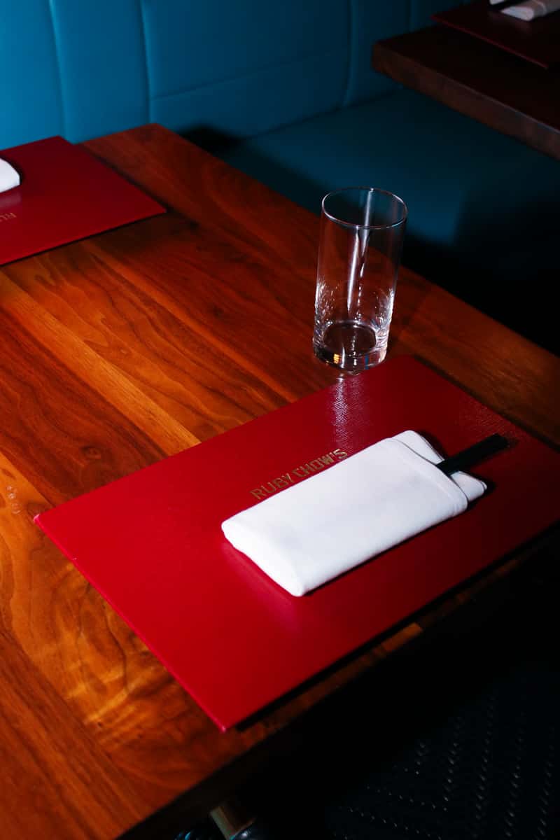 Menu and drink at wood textured table