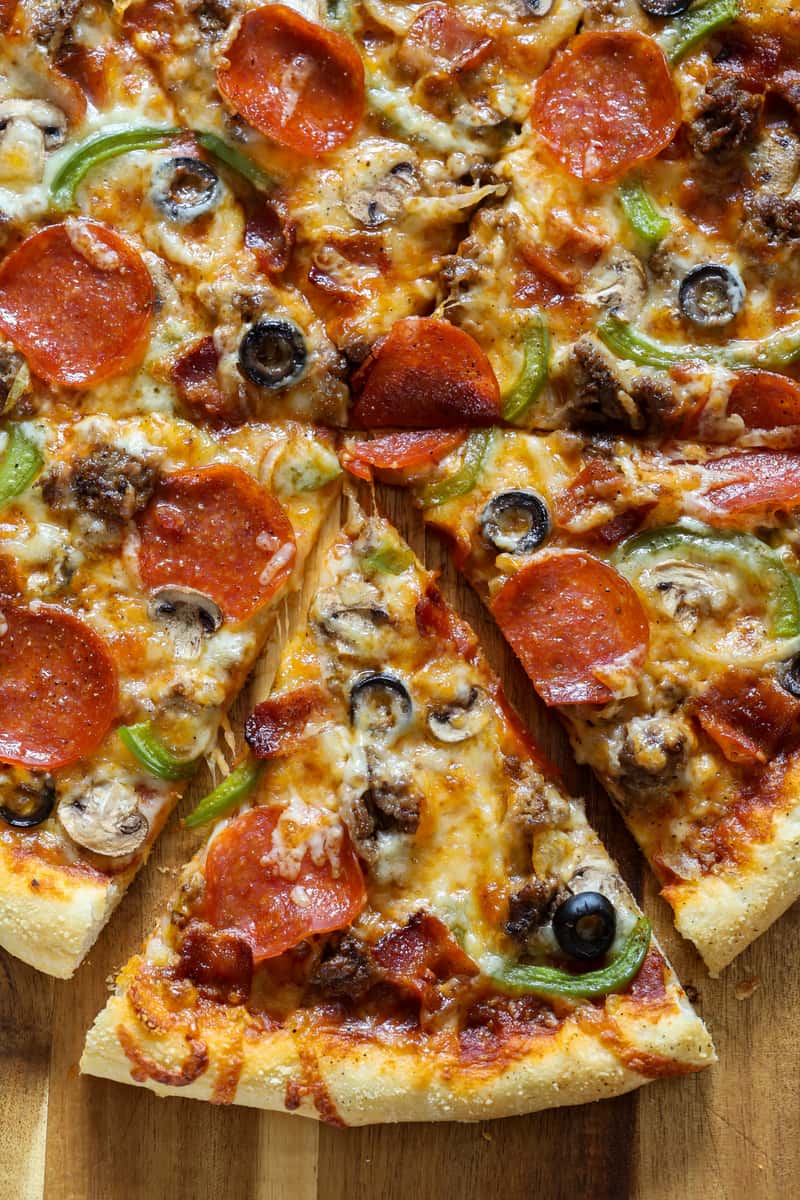 Our homemade recipe of dough tossed topped with our homemade special sauce, covered with a blend of our finest cheese ￼ topped with sausage, mushrooms, pepperoni onions, peppers, and olives