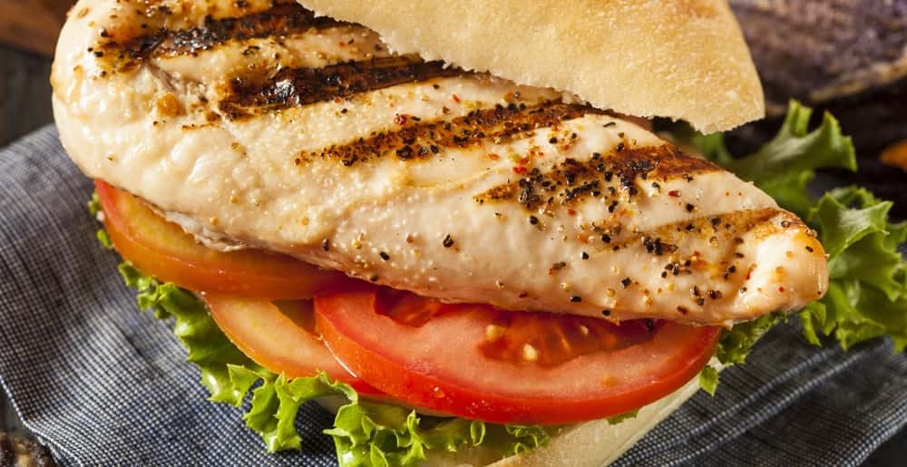 Grilled chicken seasoned with our own home seasoning grill to perfection served on a Kaiser roll with your choice of toppings