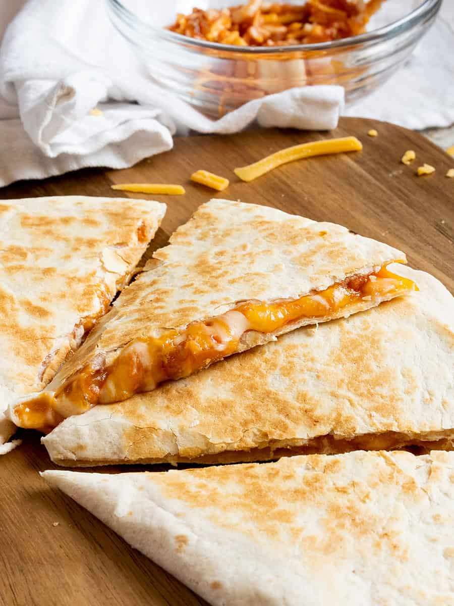 A blend of cheese melted over a tortilla grilled to perfection served with sour cream
