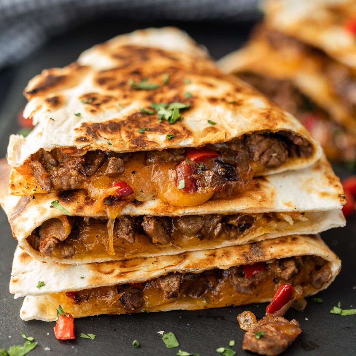Chopped steak with mixed blanch cheese, grilled to perfection stuffed into a tortilla served with sour cream