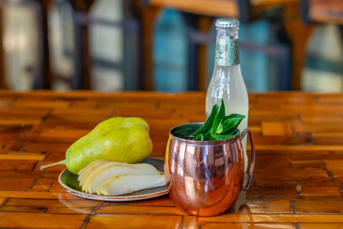 pear cocktail in copper tumbler