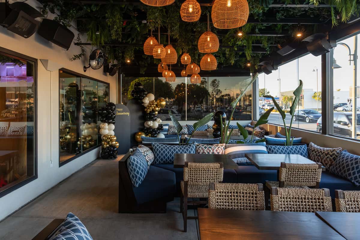 Decorated event space featuring lounge chairs and warm lighting