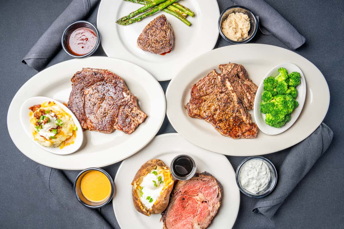 different steak dishes on flat lay shot
