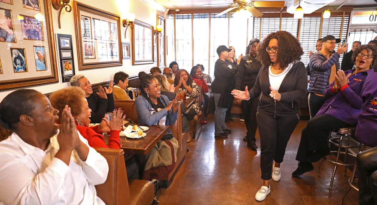 Oprah greeting diners at The Busy Bee