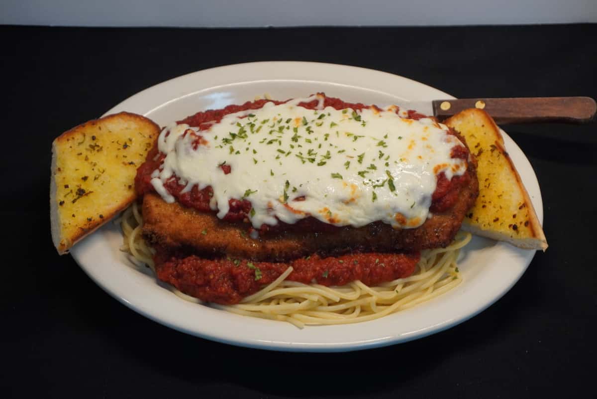 Boneless chicken breast lightly breaded and seasoned, topped with mozzarella cheese and Roma sauce. Served with spaghetti.