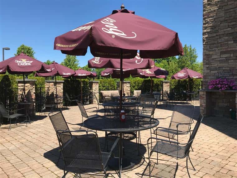 outsdoor patio tables, chairs, and umbrellas