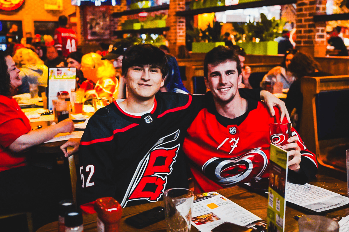 Two smiling Canes fans at Carolina Ale House Cary