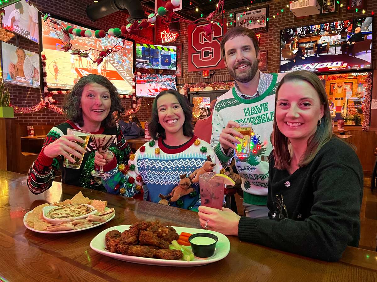 Group of people celebrating the holidays at Carolina Ale House
