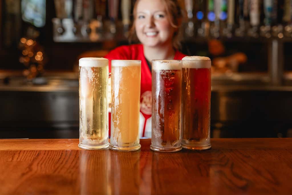 Picture of bartender with beer mugs