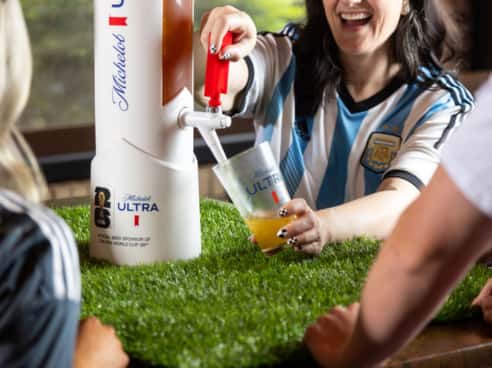 Picture of beer tower and soccer fan