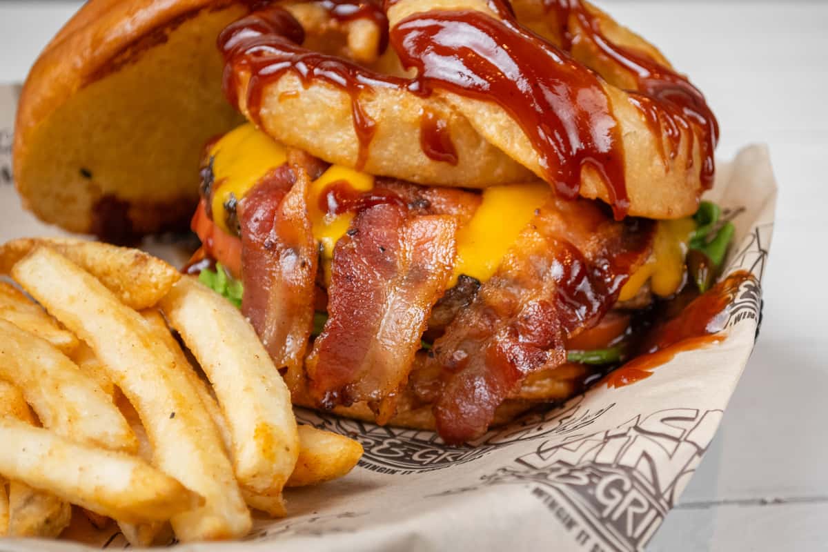 Close up of BBQ Burger with fries