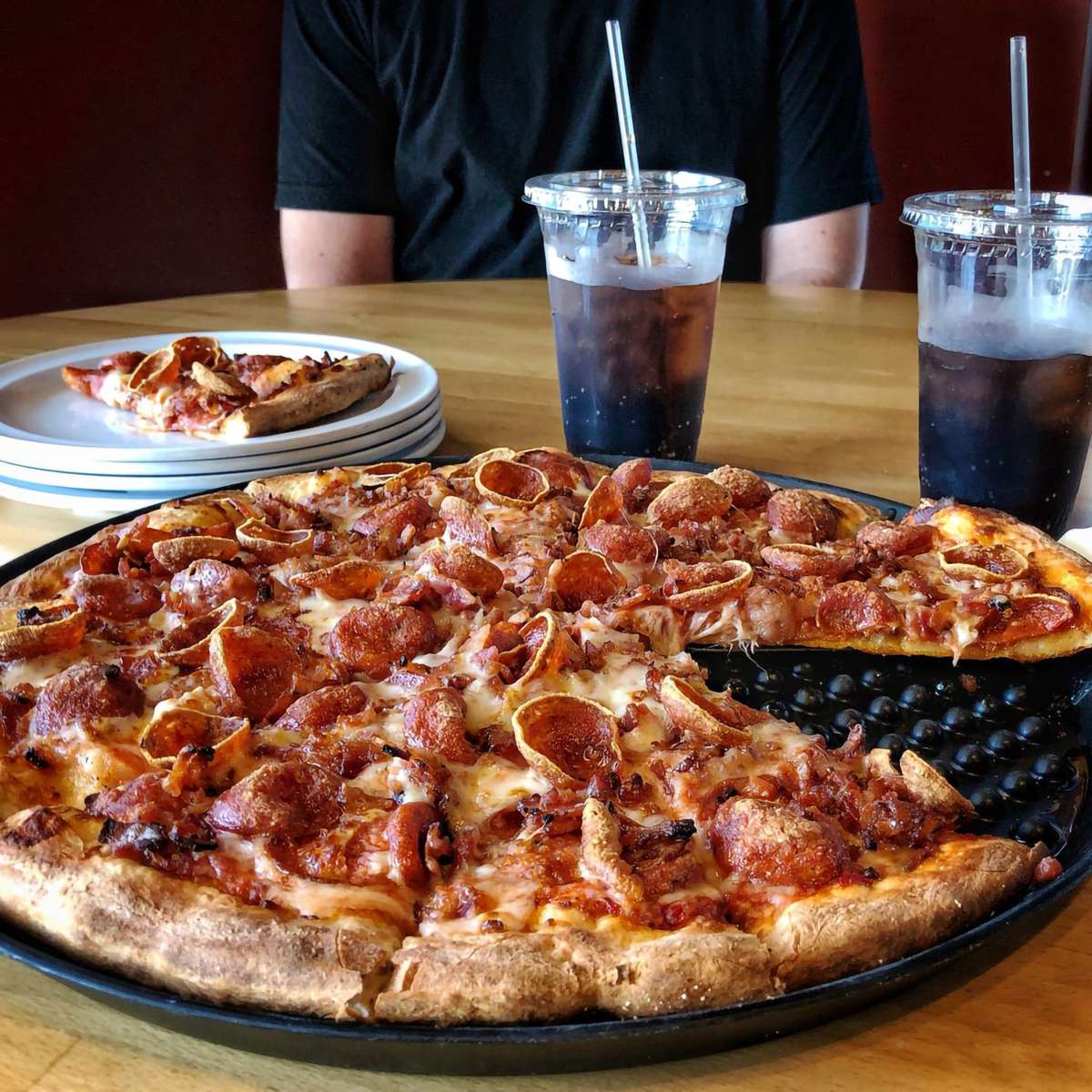 Double pepperoni pizza with beverages