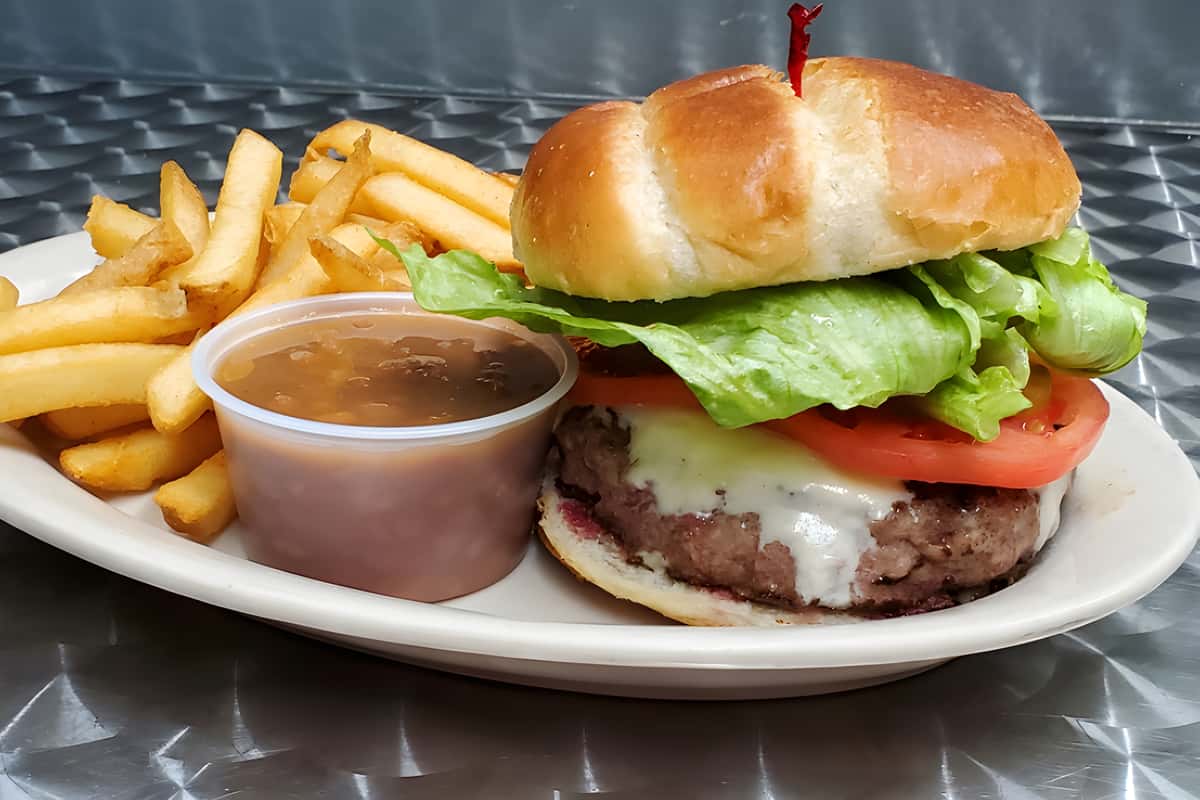 Burger with cheese tomato and lettuce with fries