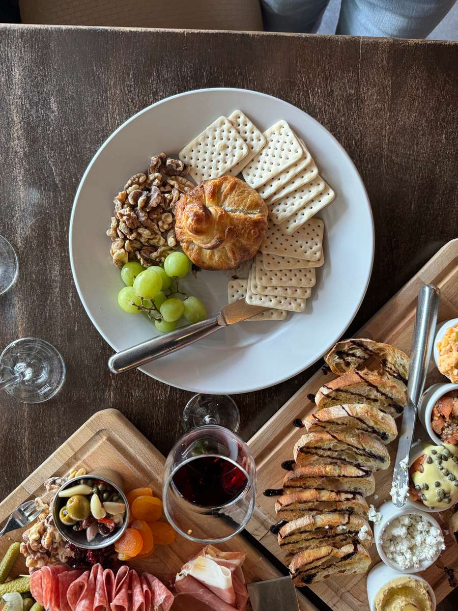 wine with charcuterie boards and cheese and cracker plate