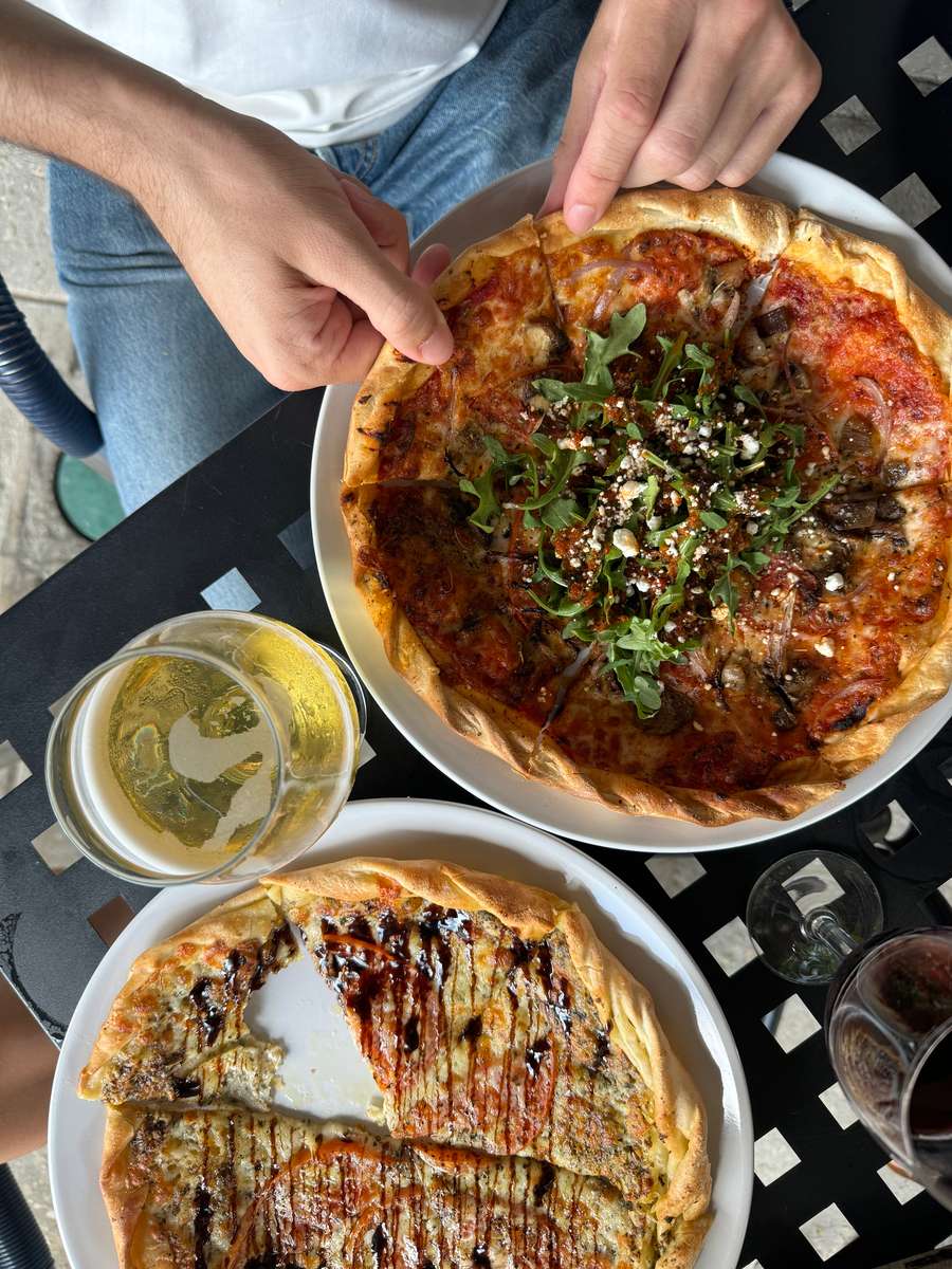 quiche and flat bread with glass of wine
