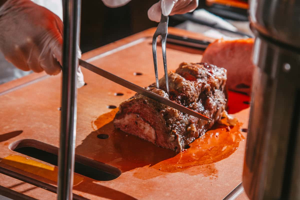 Cook cutting meat