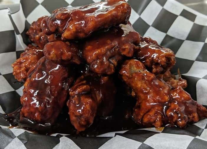 Chicken wings tossed on barbecue sauce