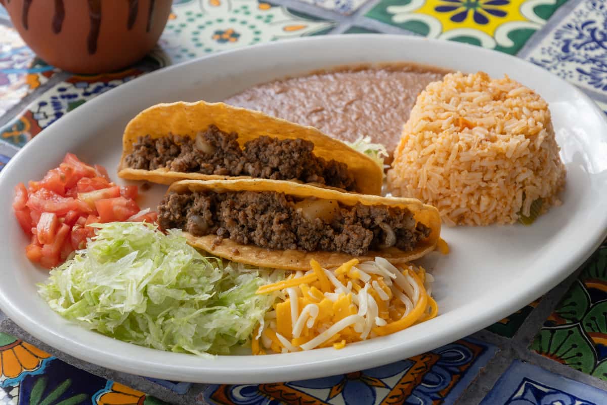 Tacos with salad, rice and beans