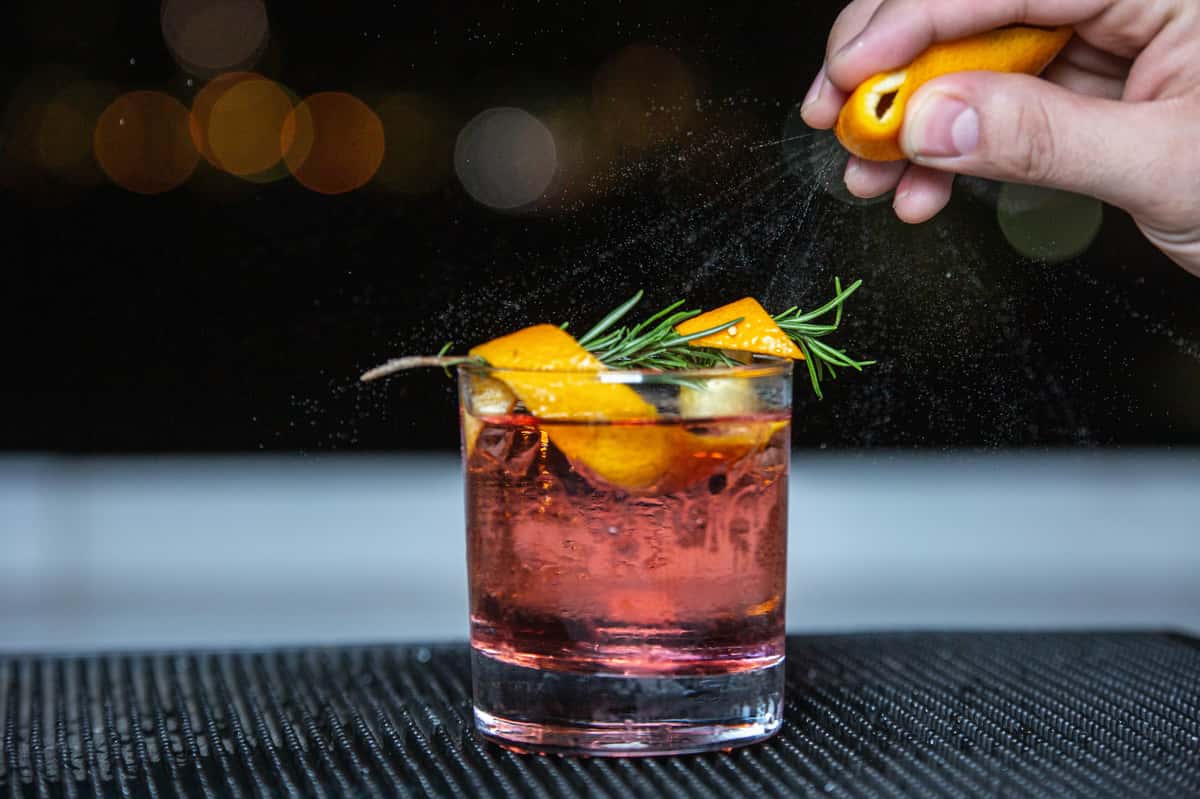 cocktail with thyme and orange peels