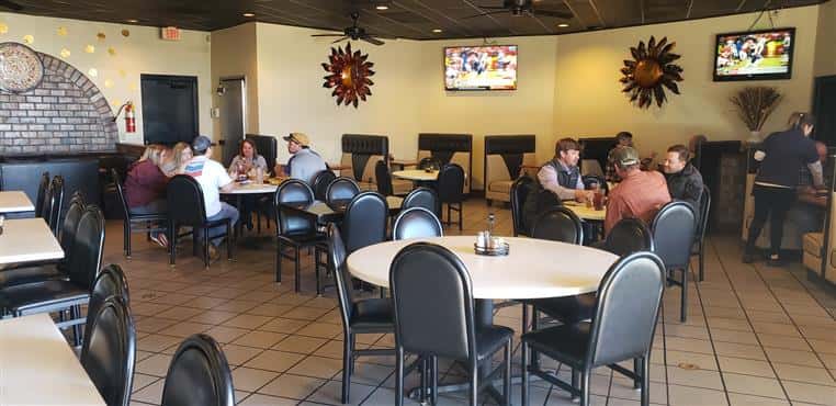 Interior dining area with tables of customers