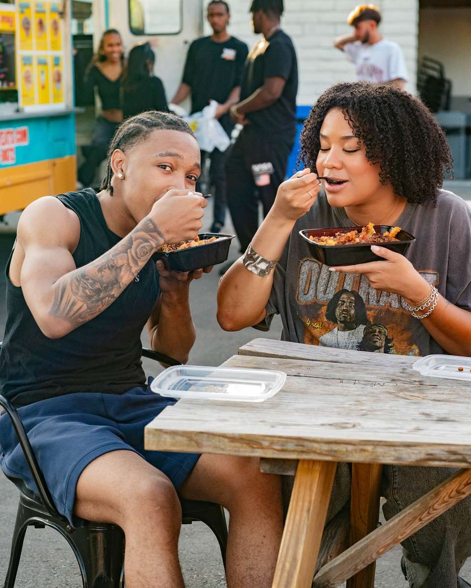 Coworkers enjoying FryDay loaded fries at a tech company catering event in LA