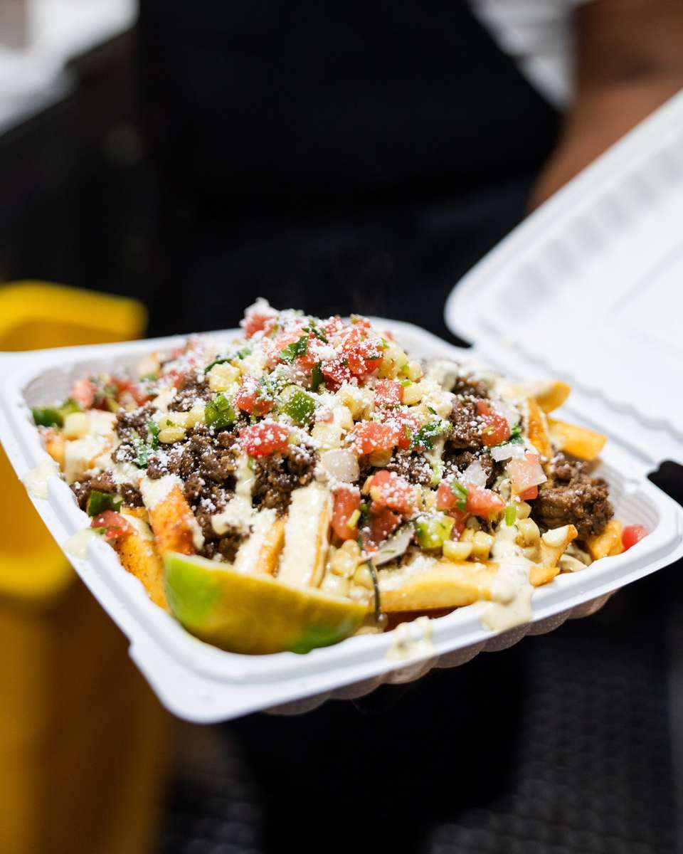 Guests enjoying FryDay loaded fries at a Los Angeles quinceañera event