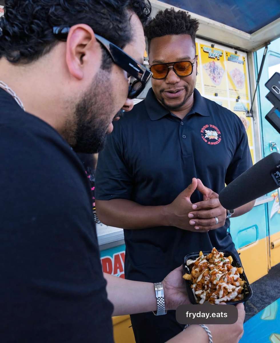 FryDay Food Truck crew members working together at the truck in Los Angeles, illustrating food truck franchise staffing