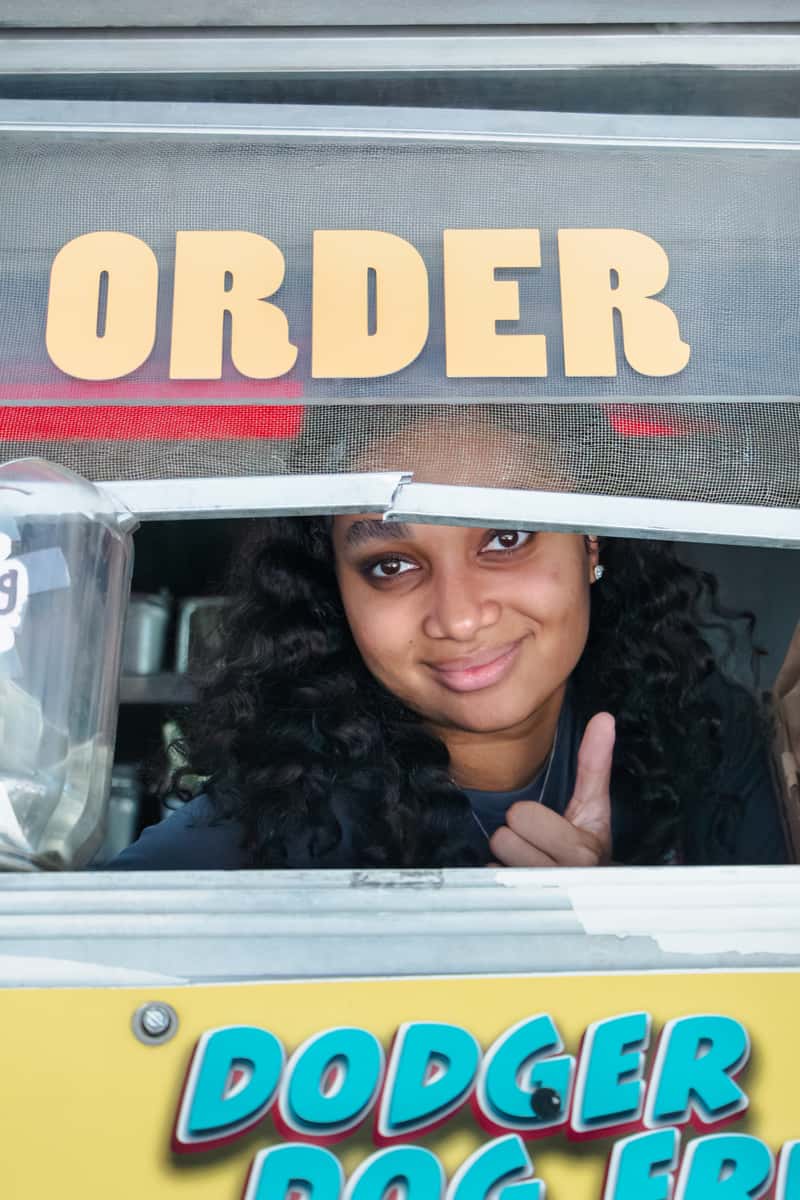 Guest ordering loaded fries at a FryDay Food Truck fall gathering in Los Angeles
