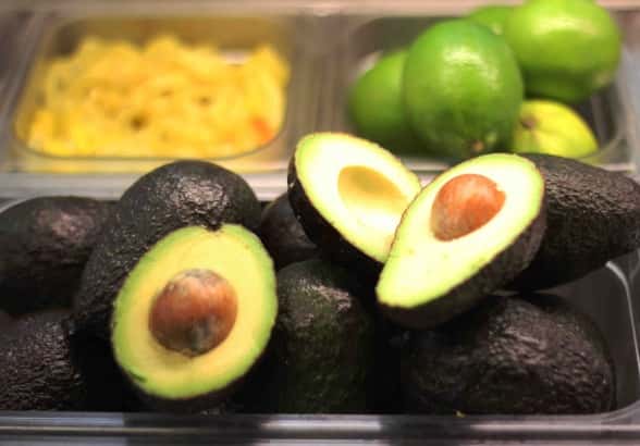 Avocados and limes in food prep containers