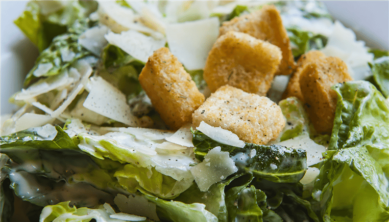caesar salad with croutons and parmesan cheese