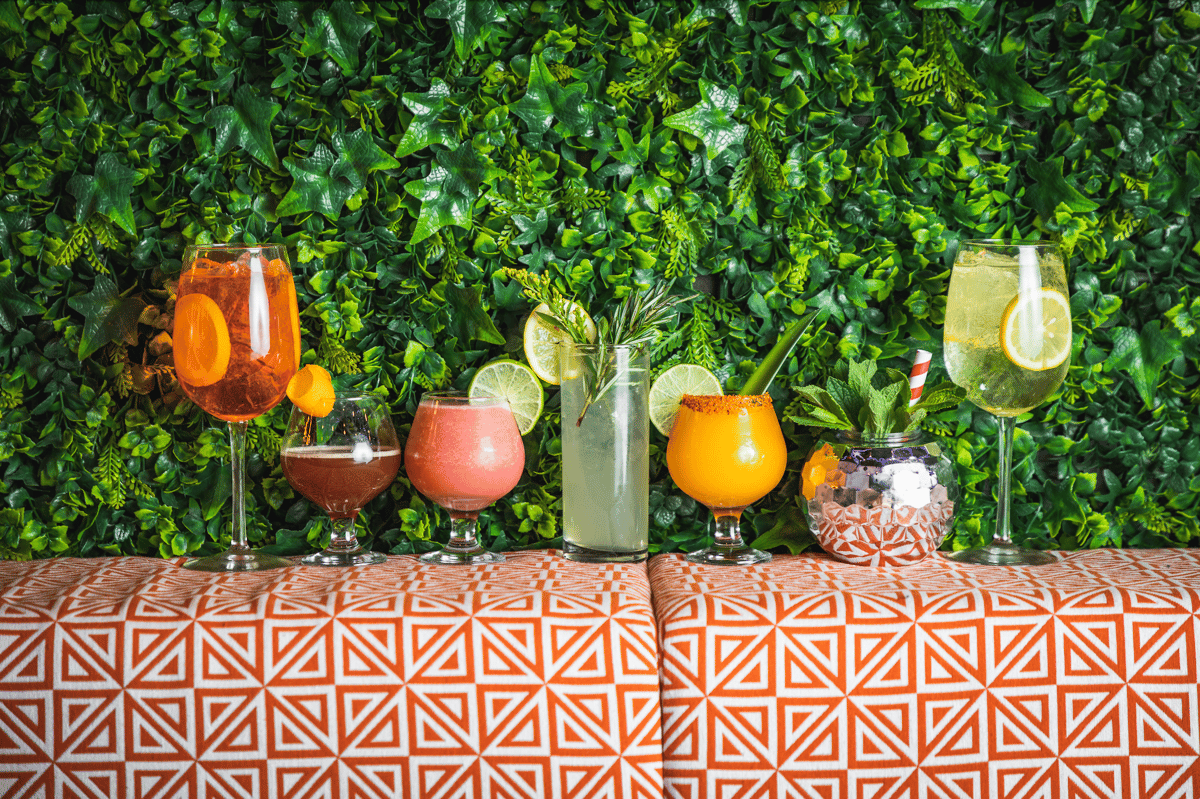 colorful cocktails on leafy backdrop