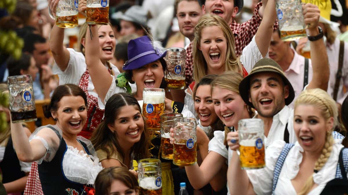 Group of people holding beer steins