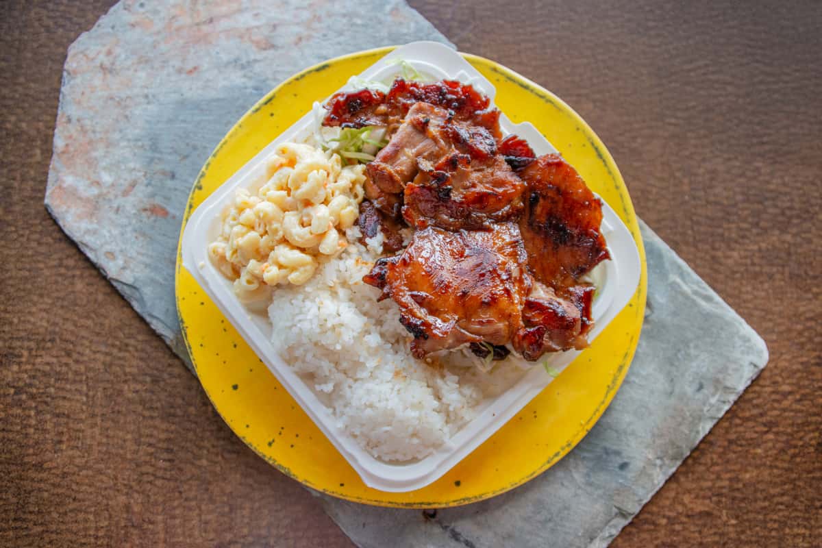 BBQ chicken plate with rice and macaroni salad