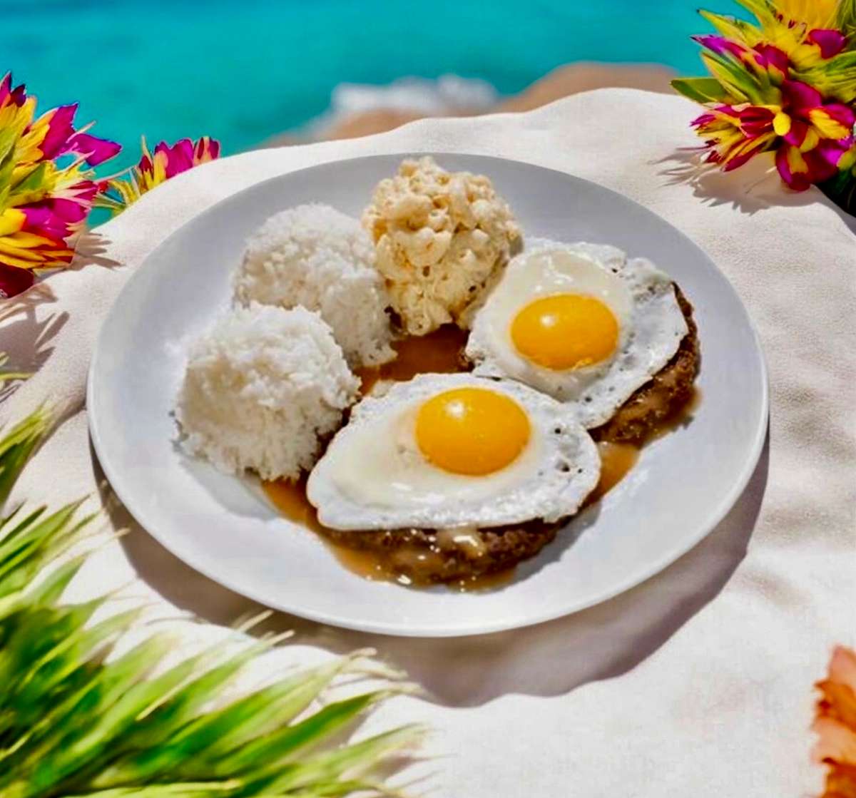 Savory hamburger patties over rice, topped with brown gravy, fresh fried eggs and Mac Salad.