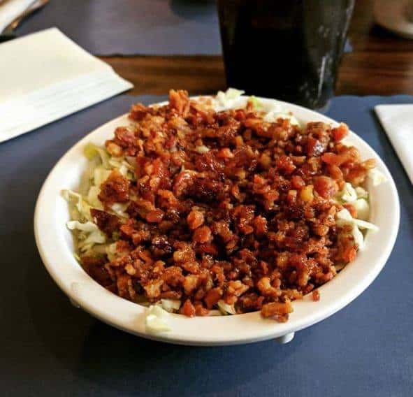 salad topped with bacon bits