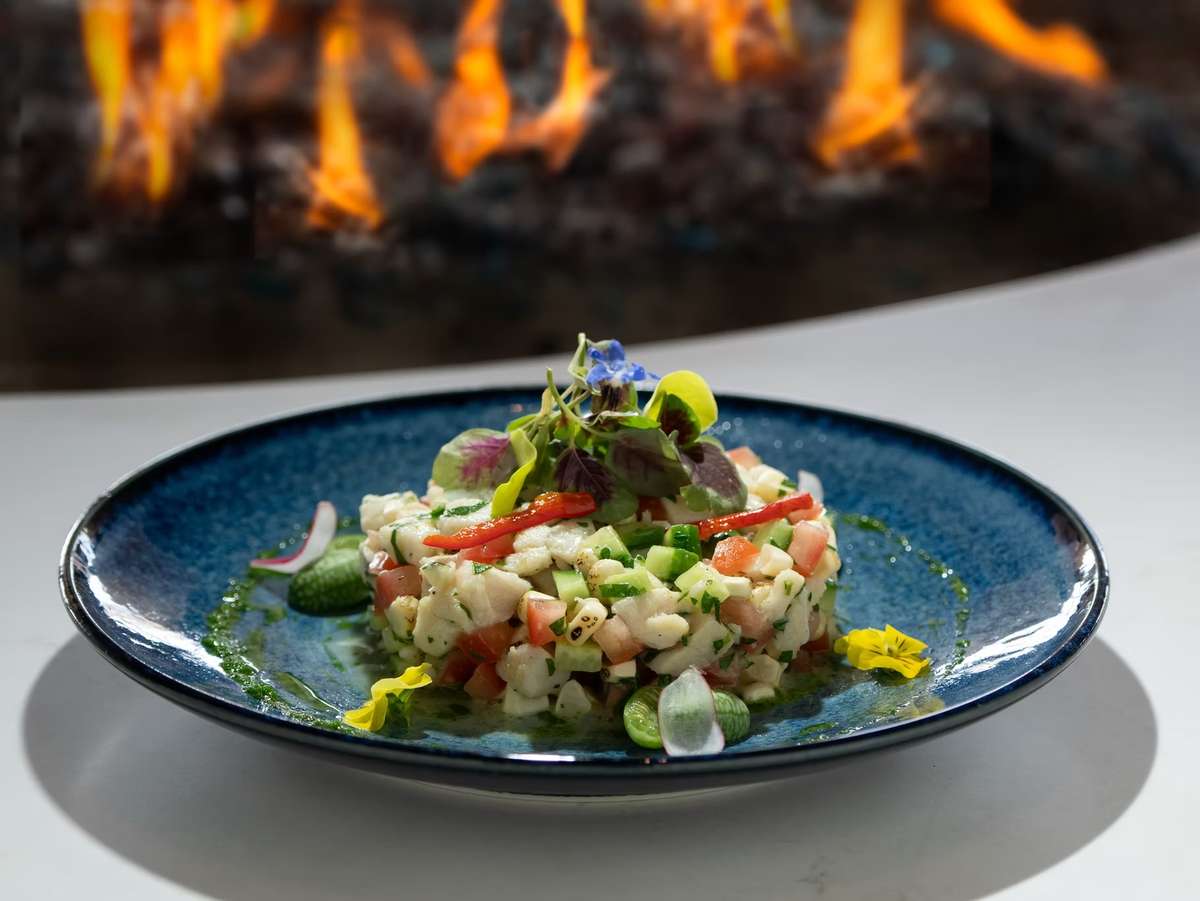 Poseidon Restaurant in Del Mar with oceanfront dining views, celebrating OpenTable Top 10 Diners’ Choice awards for best overall, seafood, ambiance, service, romance, scenic views, and most booked.