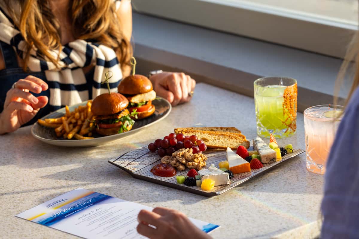 Menus, food, and drinks on a table