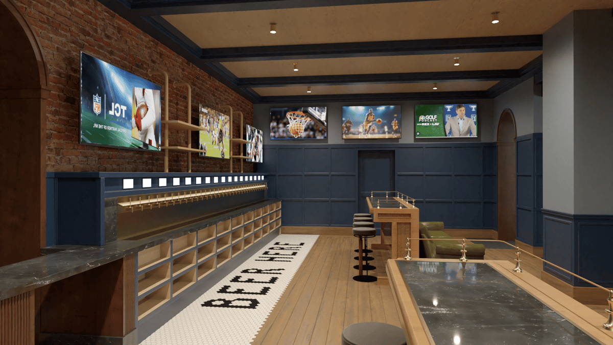 Upscale sports bar interior with a long self-serve beer tap wall, multiple TVs showing live sports, exposed brick, and modern wood seating.