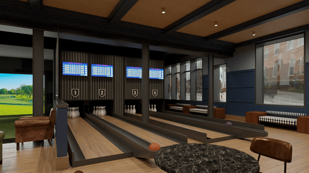 Stylish indoor bowling lanes inside a modern entertainment bar, featuring digital score screens, leather seating, and polished wood lanes.