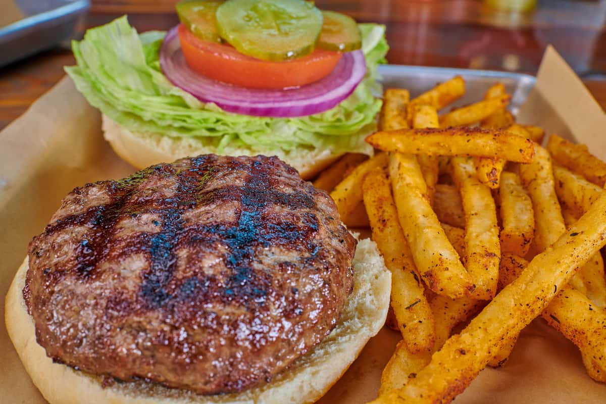 Our signature blend of hand pattied beef with lettuce, tomato and onion