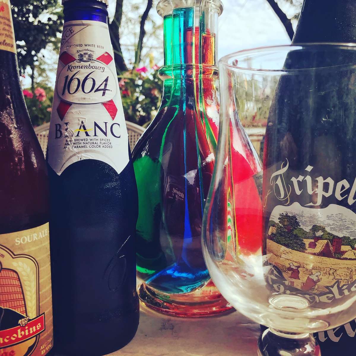 Assorted bottles of beer and glasses