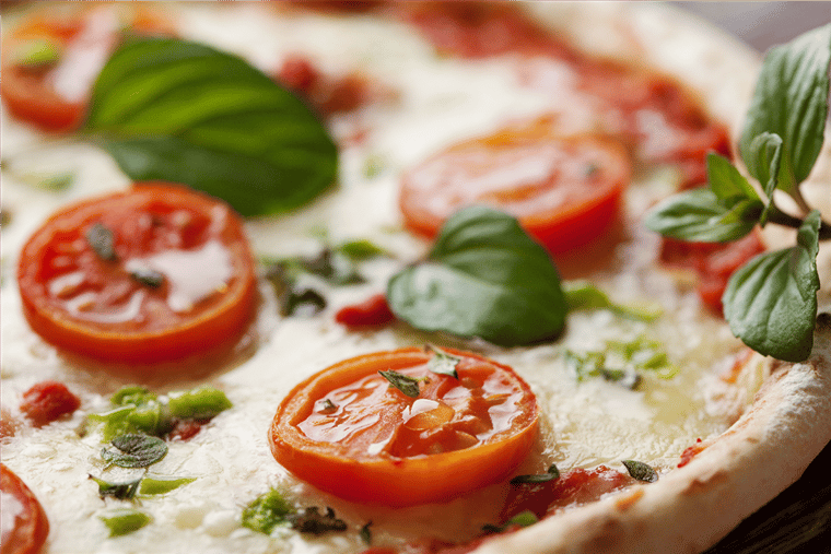 margherita pizza with tomatoes and basil