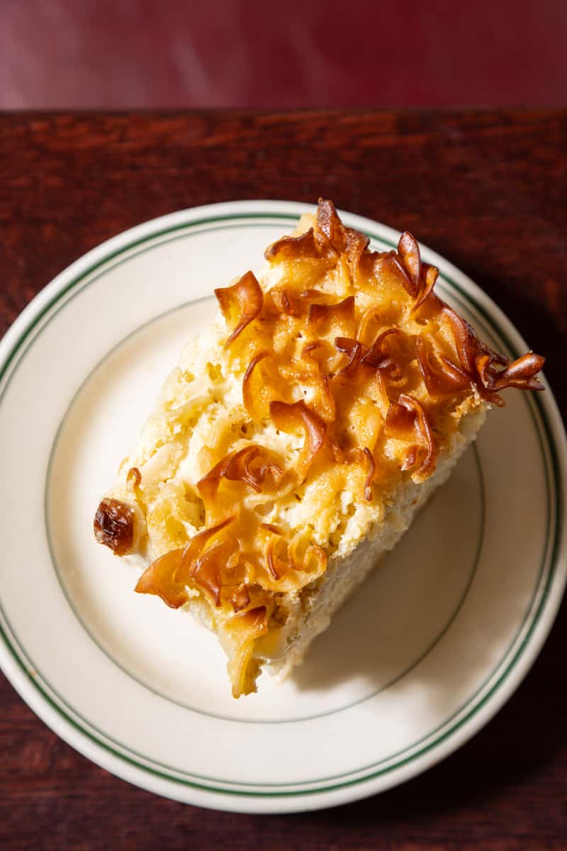Traditional sweet noodle kugel from Famous 4th Street Delicatessen — classic Jewish-style comfort food for Yom Kippur and Rosh Hashanah.