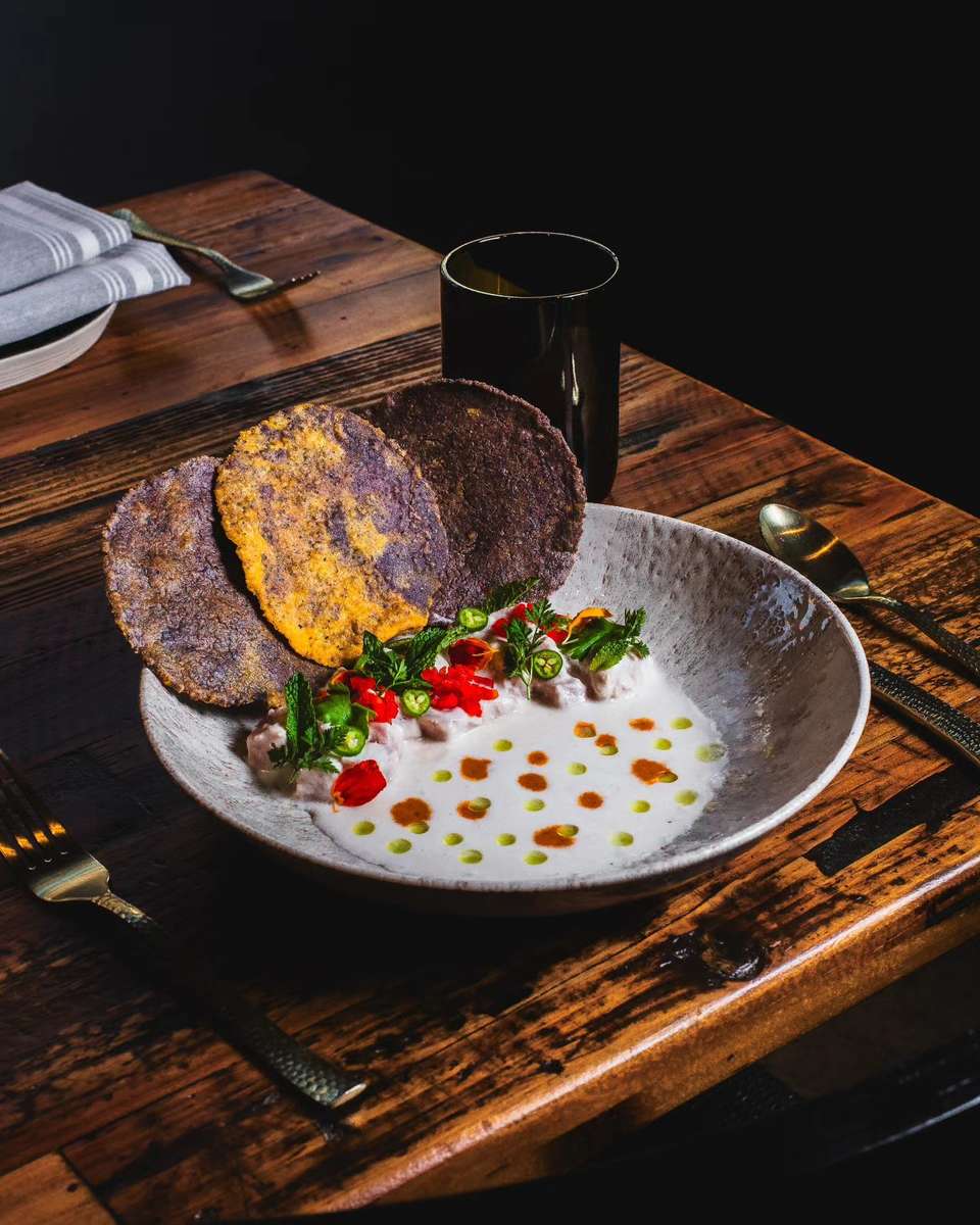 Saucy bowl served with crispy side dishes