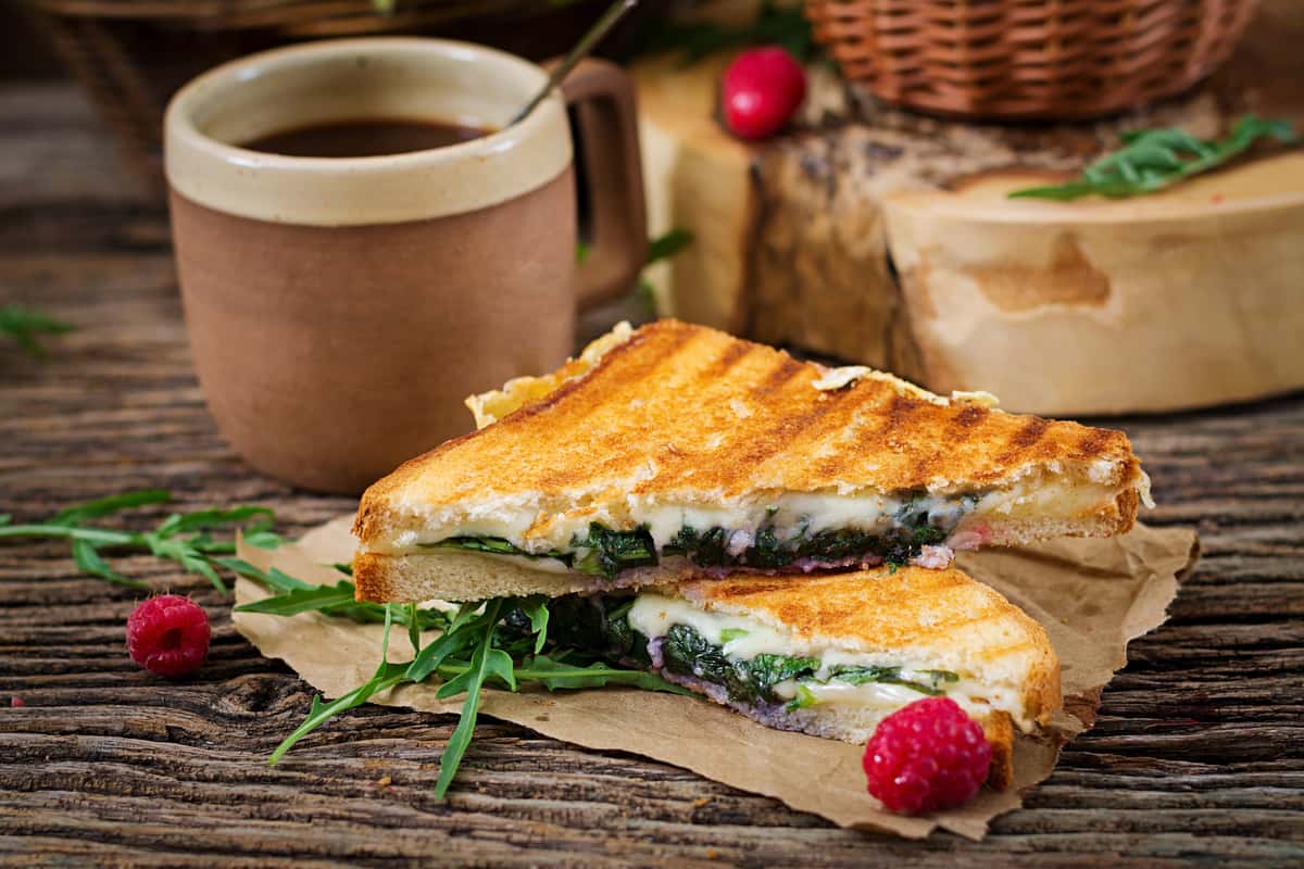 Sandwich with cheese mustard and leaves
