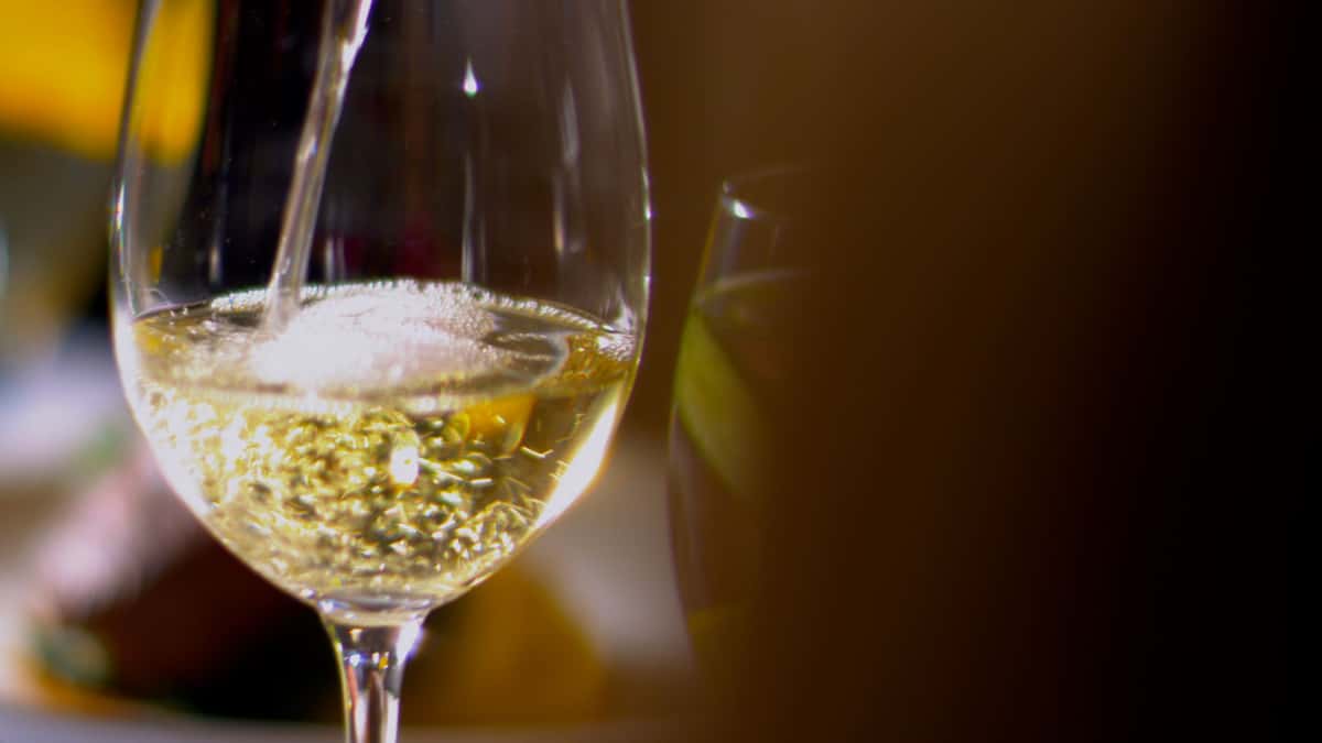 Wine being poured into a glass