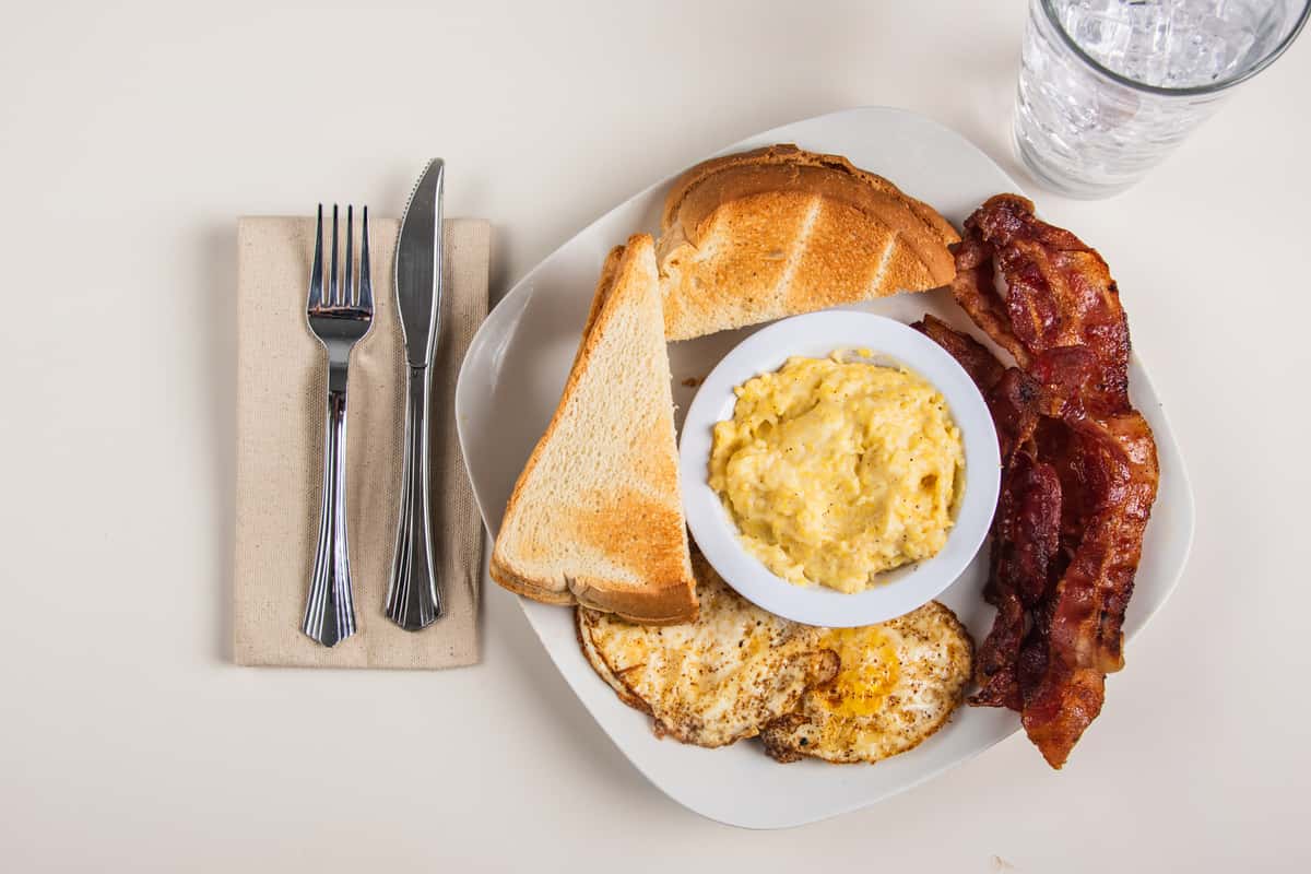 Eggs Bacon Cheesy Grits And Toast